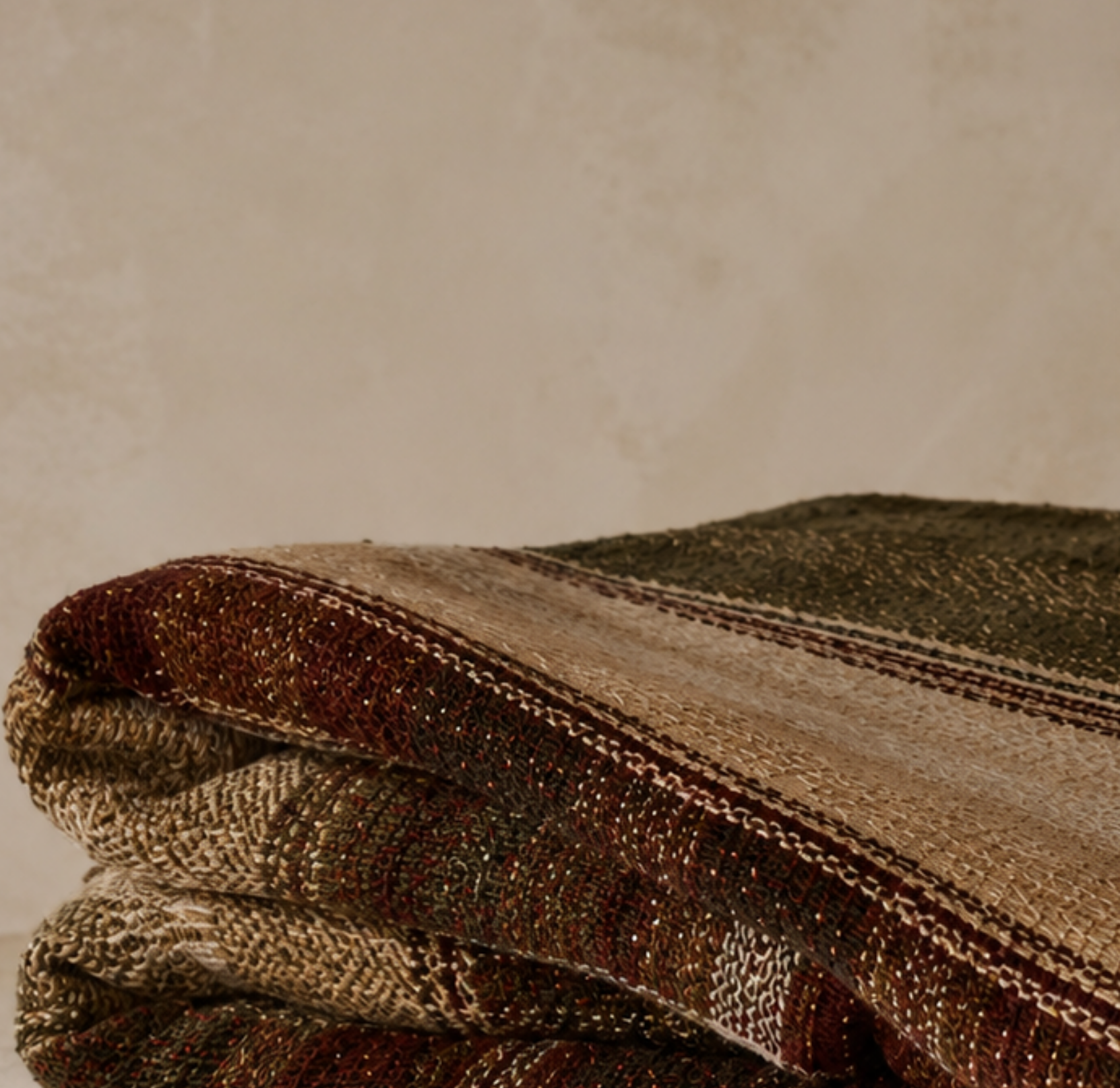 Hudson Valley Plaid woven cotton throw blanket folded to show full plaid pattern in espresso cider oat moss and sage with multicolor fringe detail