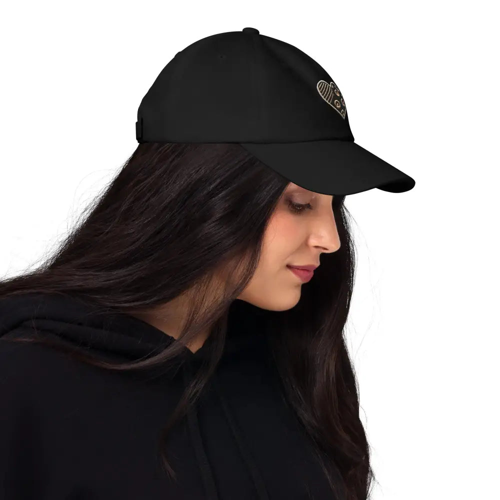 Woman in animal print embroidered heart dad hat
