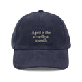 Dark blue corduroy hat with cruellest month embroidery
