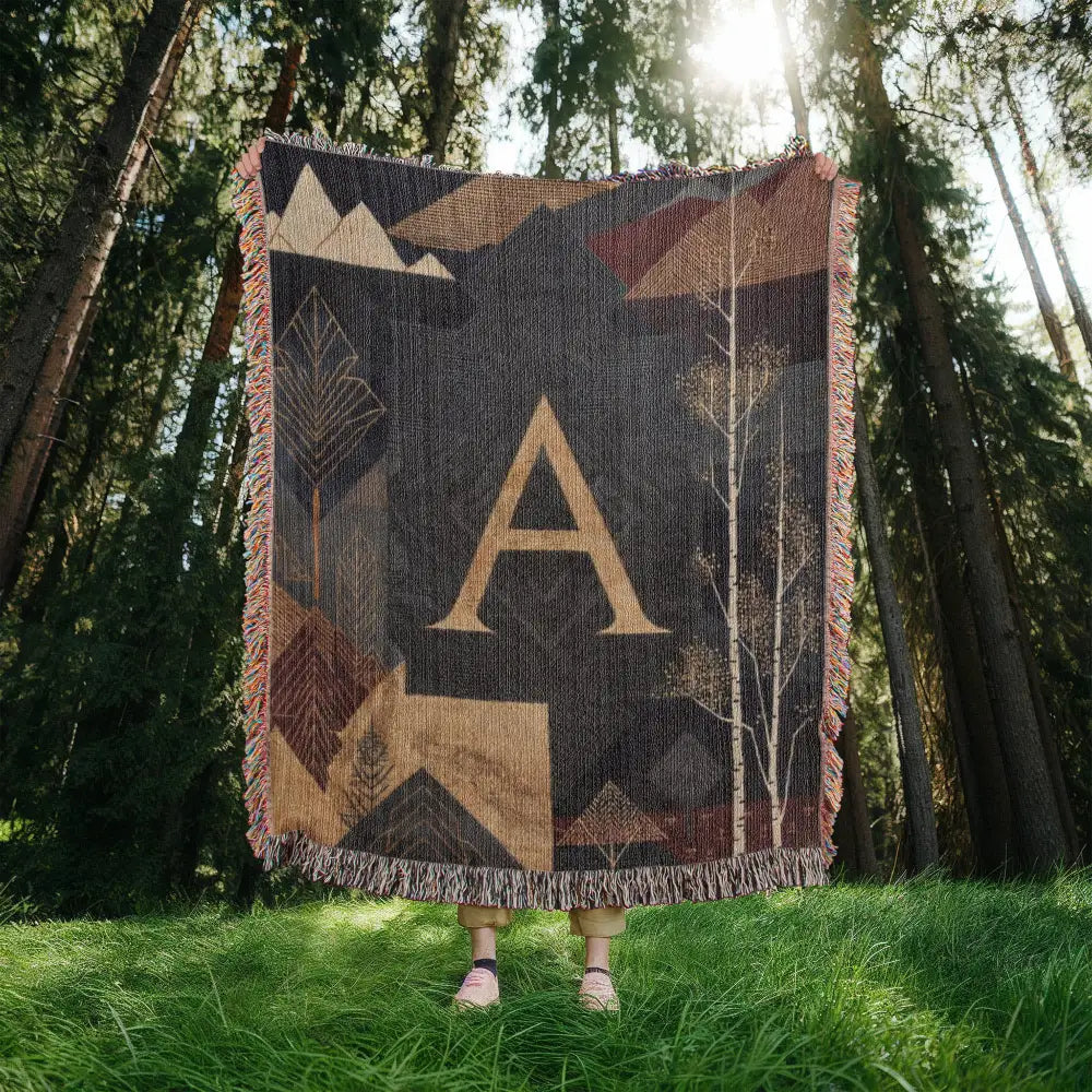 Aspen initial woven blanket with alpine mountain tapestry in forest