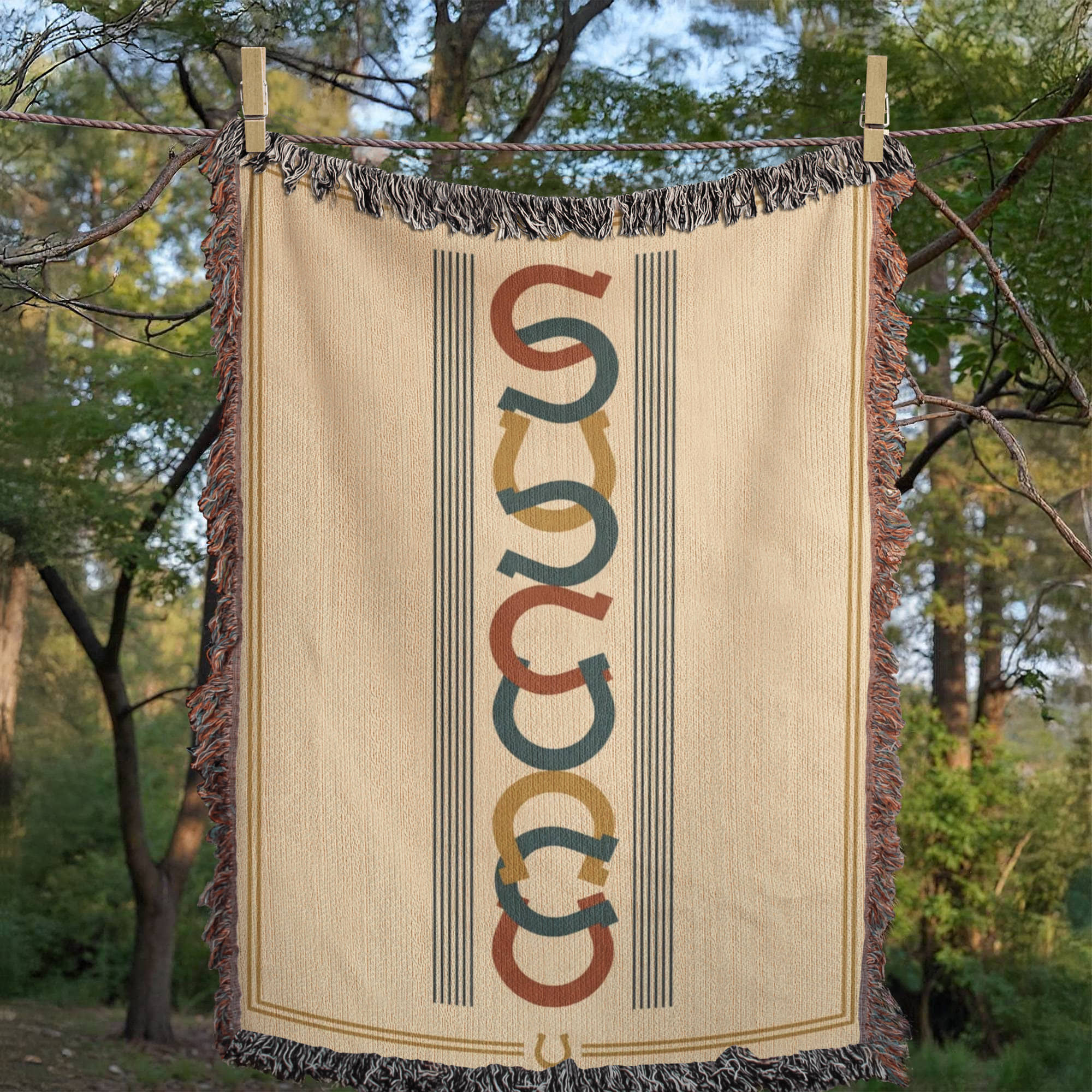 Woven mockup of the Horseshoe Row design showing the repeating horseshoe motif column on an ivory field, before final rendering — Trini Skies