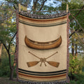 The Portage canoe and crossed paddles woven throw blanket with woven fringe — Trini Skies