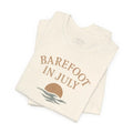 Folded cream t-shirt with Barefoot in July graphic from Trini Skies Supply
