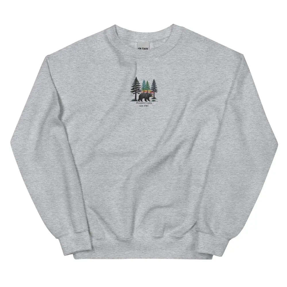 Heather gray Gildan sweatshirt with Trini Skies forest embroidered bear design