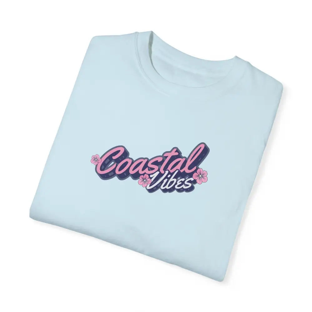 Garment-dyed unisex Coastal Vibes tee in light blue with pink flowers