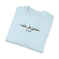 Light blue garment-dyed unisex t-shirt with floral graphic