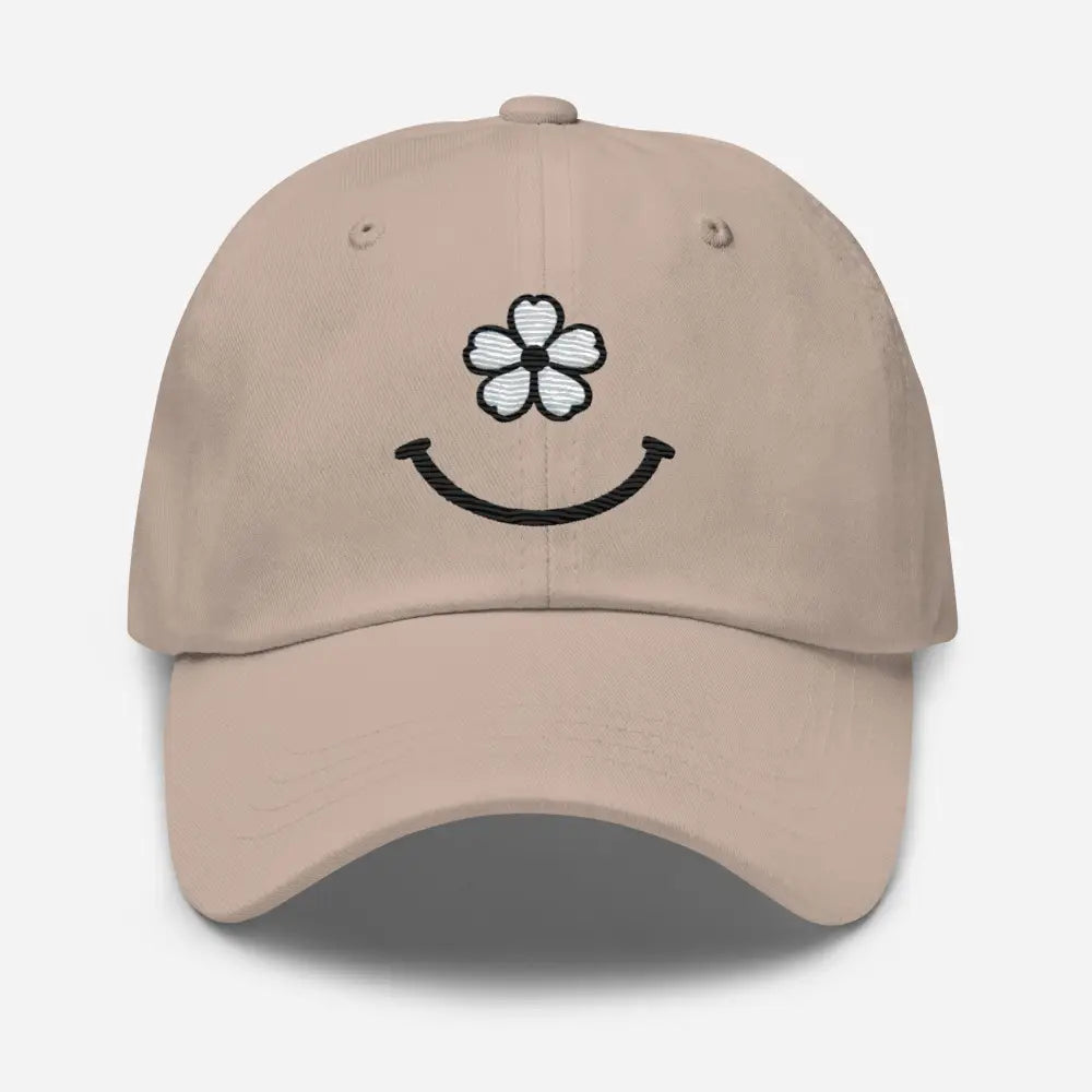 Light brown floral smiley face dad hat with embroidered white flower