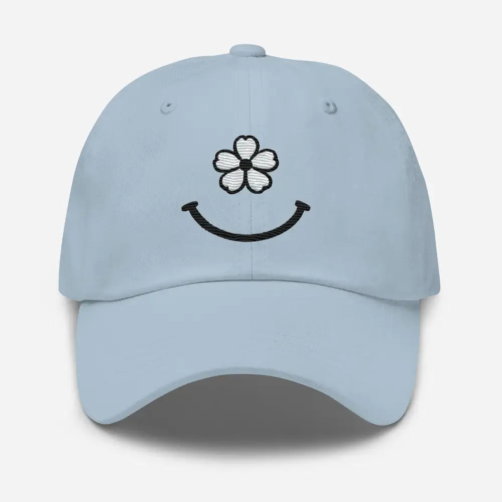 Light blue floral smiley face dad hat with white flower embroidery