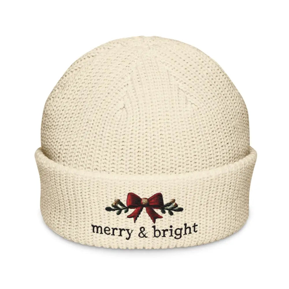 Cream-colored embroidered corduroy cap with bright Christmas bow