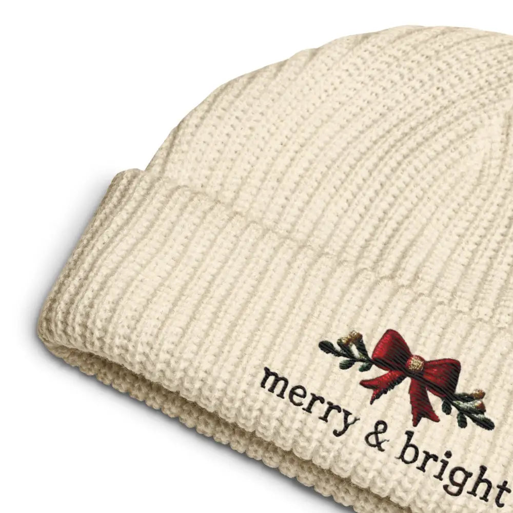 Cream-colored ribbed knit beanie with bright Christmas bow embroidery