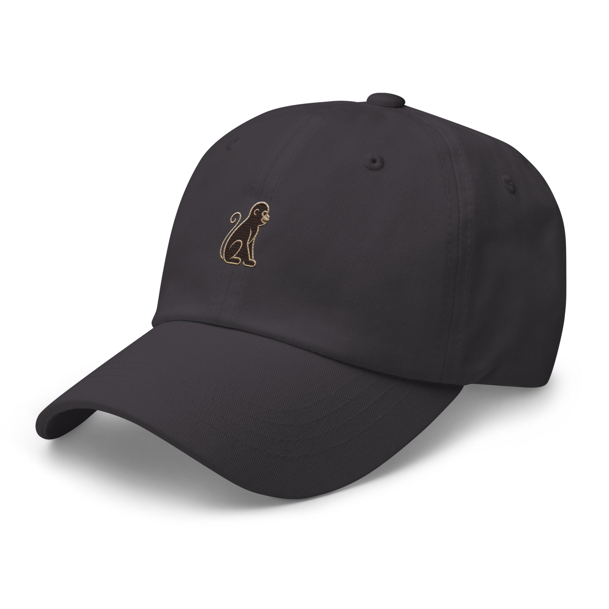 Signature Monkey Embroidered Dad Hat by Trini Skies in dark grey cotton twill, left front view showing monkey emblem embroidery
