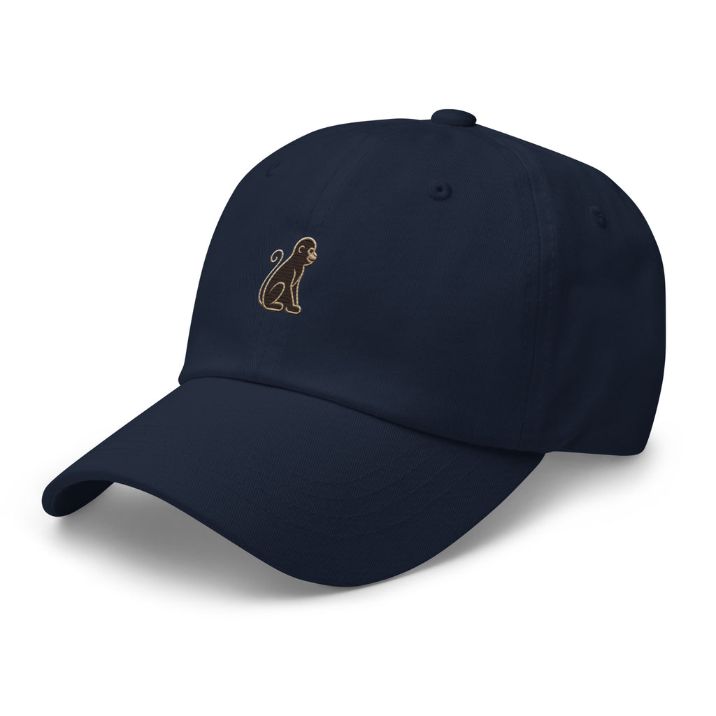 Signature Monkey Embroidered Dad Hat by Trini Skies in navy cotton twill, left front view showing monkey emblem embroidery