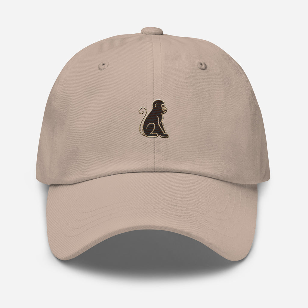 Signature Monkey Embroidered Dad Hat by Trini Skies in stone cotton twill, front view showing monkey emblem centered on panel, curved brim