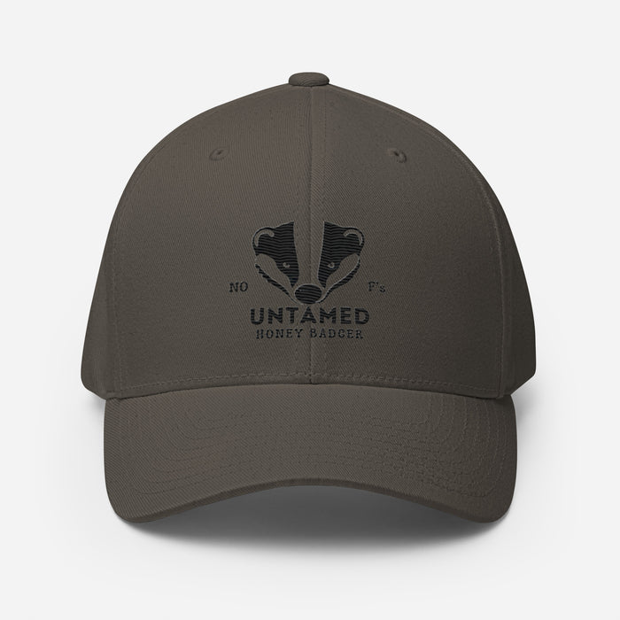 Untamed Badger Embroidered Structured Twill Cap. Stretch Fit Athletic Hat