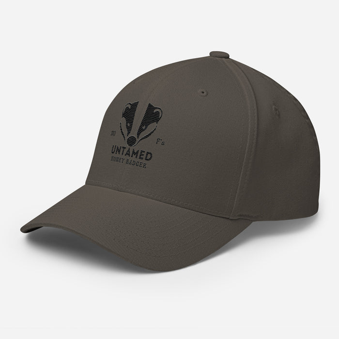 Untamed Badger Embroidered Structured Twill Cap. Stretch Fit Athletic Hat