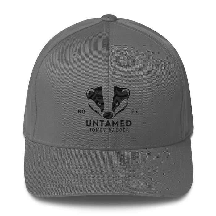 Untamed Badger Embroidered Structured Twill Cap. Stretch Fit Athletic Hat