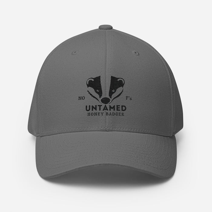 Untamed Badger Embroidered Structured Twill Cap. Stretch Fit Athletic Hat