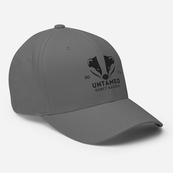 Untamed Badger Embroidered Structured Twill Cap. Stretch Fit Athletic Hat