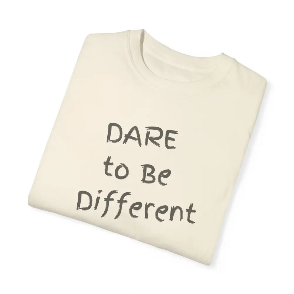 Folded cream garment-dyed t-shirt with Dare to Be Different text