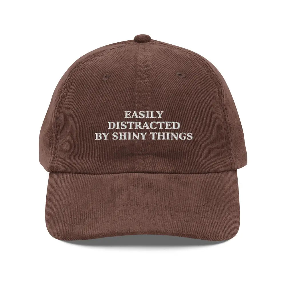 Brown embroidered corduroy cap with Trini Skies text