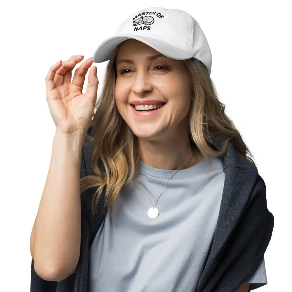 Beige embroidered Master of Naps sleeping cat baseball cap on model – funny adjustable hat