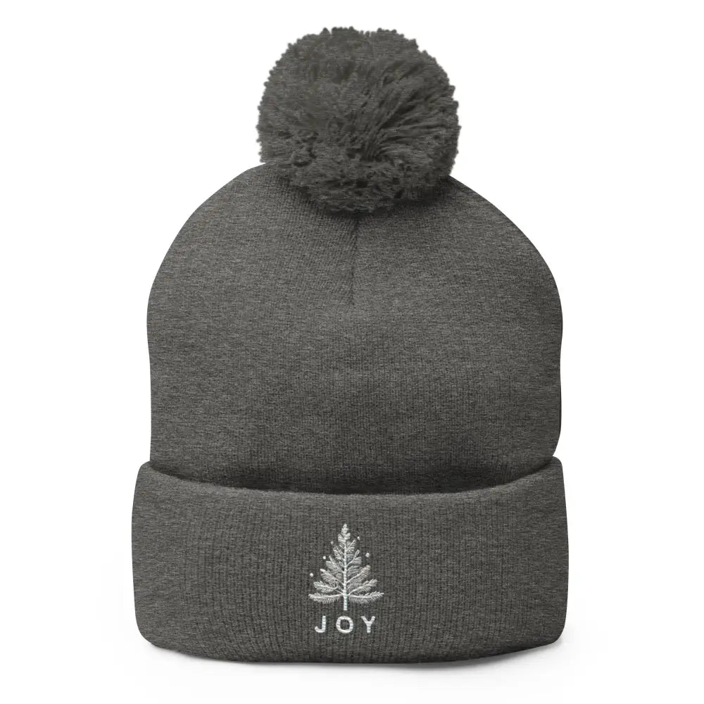 Embroidered Joy Christmas pom-pom beanie by Trini Skies with tree design
