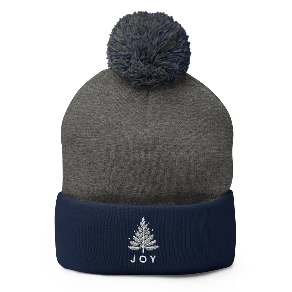 Embroidered Joy Christmas pom-pom beanie in gray and navy with tree by Trini Skies