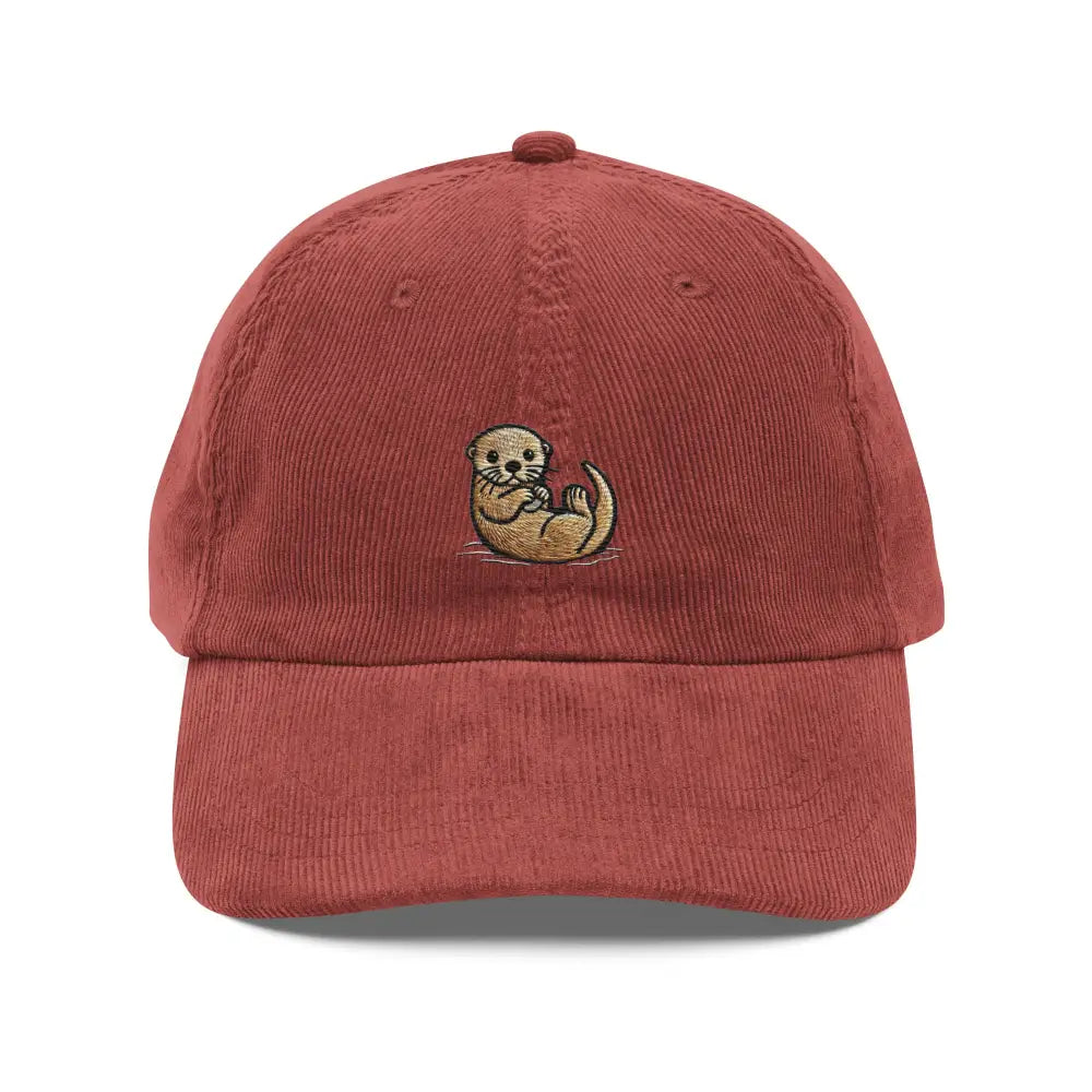 Embroidered otter hat in burgundy corduroy with a floating otter stitched on the front panel