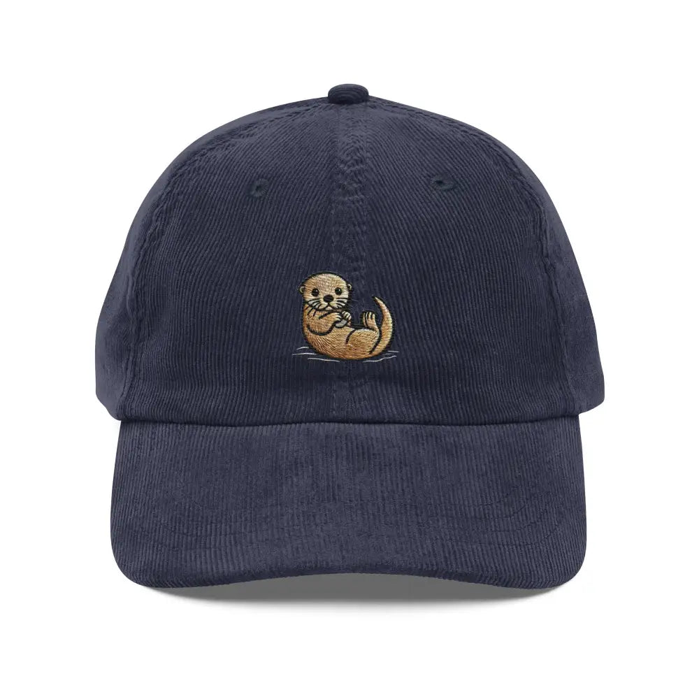 Embroidered otter hat in navy corduroy with a floating otter stitched on the front panel