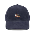 Navy blue corduroy cap with embroidered playful otter holding heart rock by Trini Skies