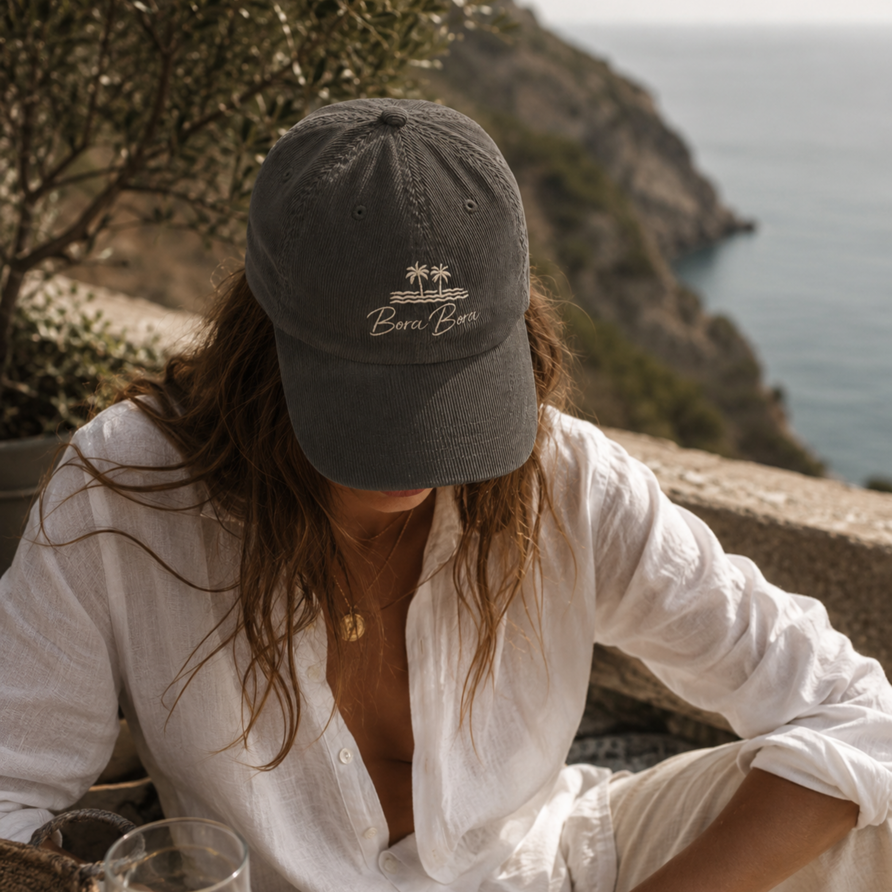 woman wearing a Embroidered Bora Bora Vintage Corduroy Cap – Classic Island Style & Comfort Vacation Destination Travel Essentials