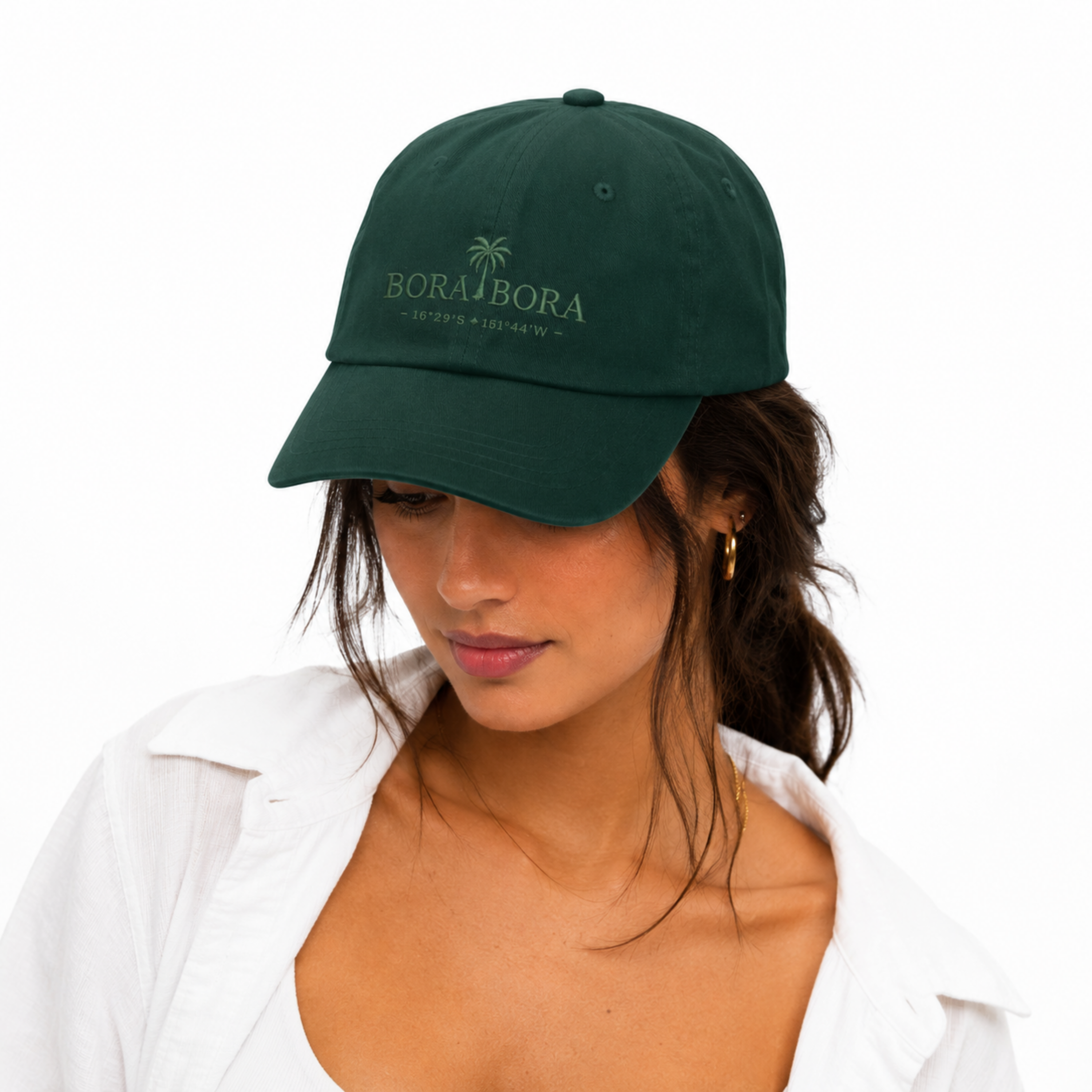 Woman wearing a green cap with 'Bora Bora' logo on a white background