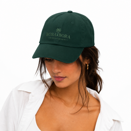 Woman wearing a green cap with 'Bora Bora' logo on a white background