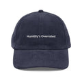 Navy blue embroidered vintage corduroy hat with white text