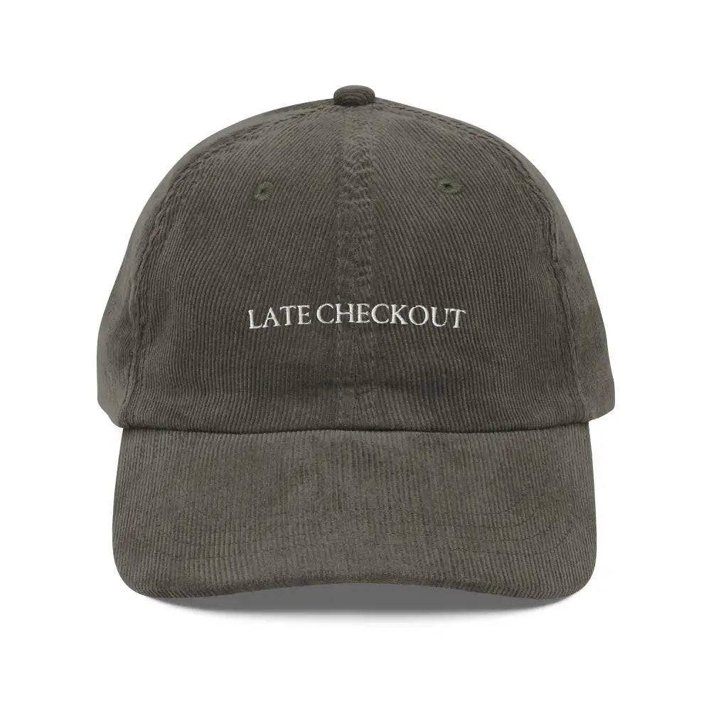 Olive green corduroy dad cap with Late Checkout embroidery