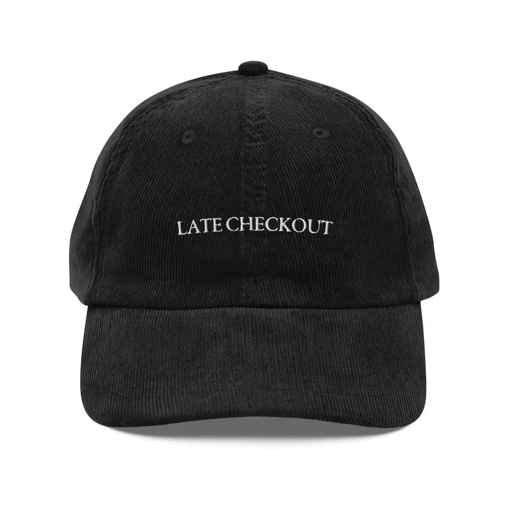 Black Late Checkout corduroy dad cap with white late checkout embroidery