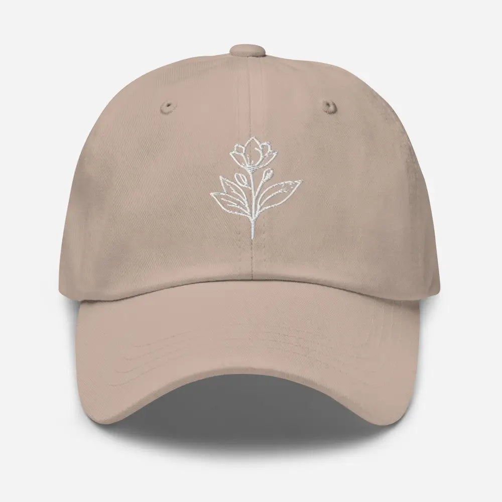 Tan minimalist embroidered floral line art dad hat on model – adjustable cotton cap
