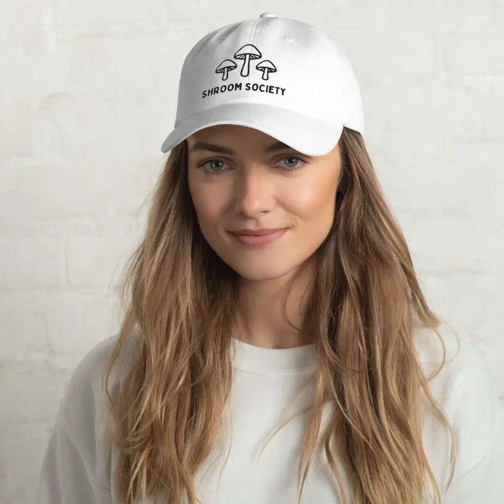 Woman wearing embroidered Shroom Society mushroom hat – adjustable cotton twill nature cap