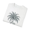Folded white ring-spun cotton t-shirt with gray palm tree graphic