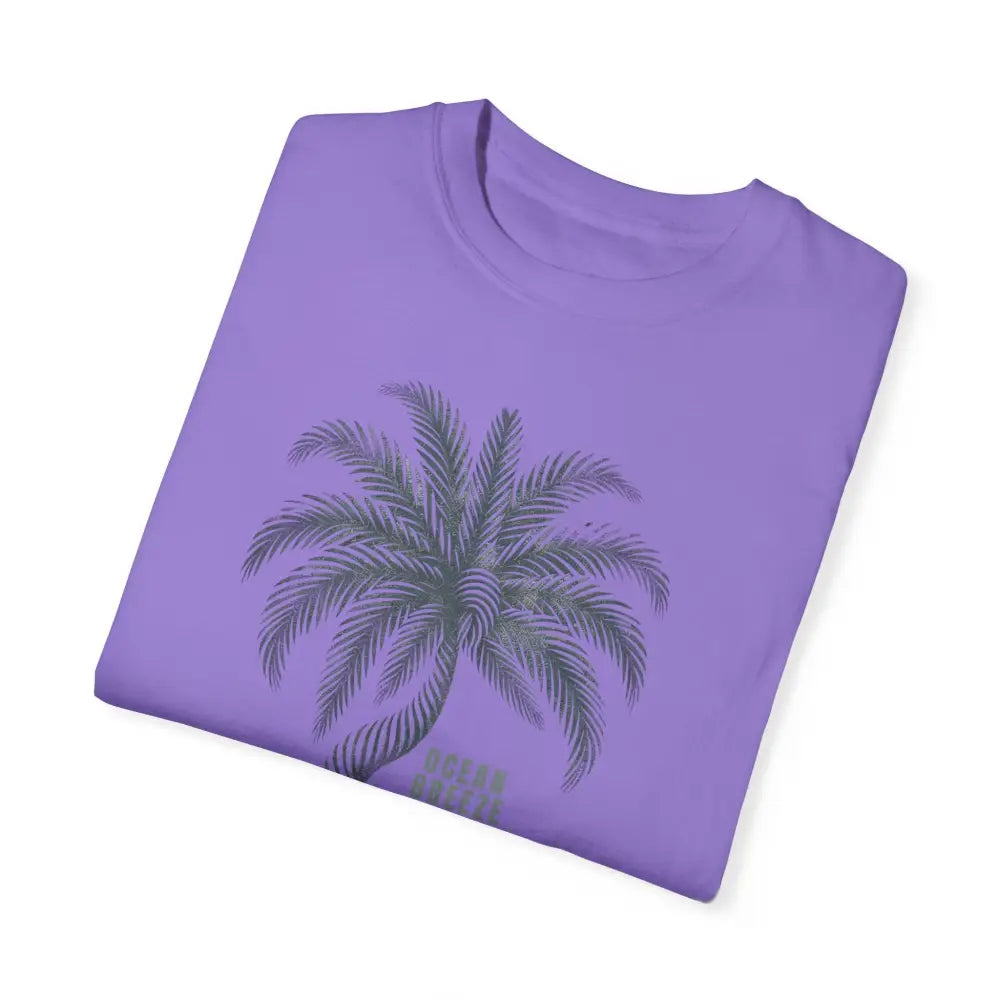 Folded purple ring-spun cotton t-shirt with grey palm tree graphic