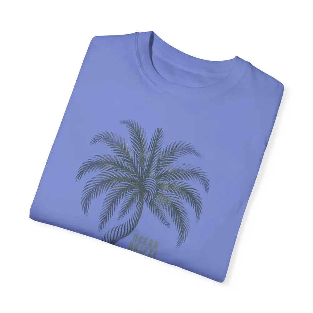 Folded periwinkle blue ring-spun cotton t-shirt with palm tree graphic