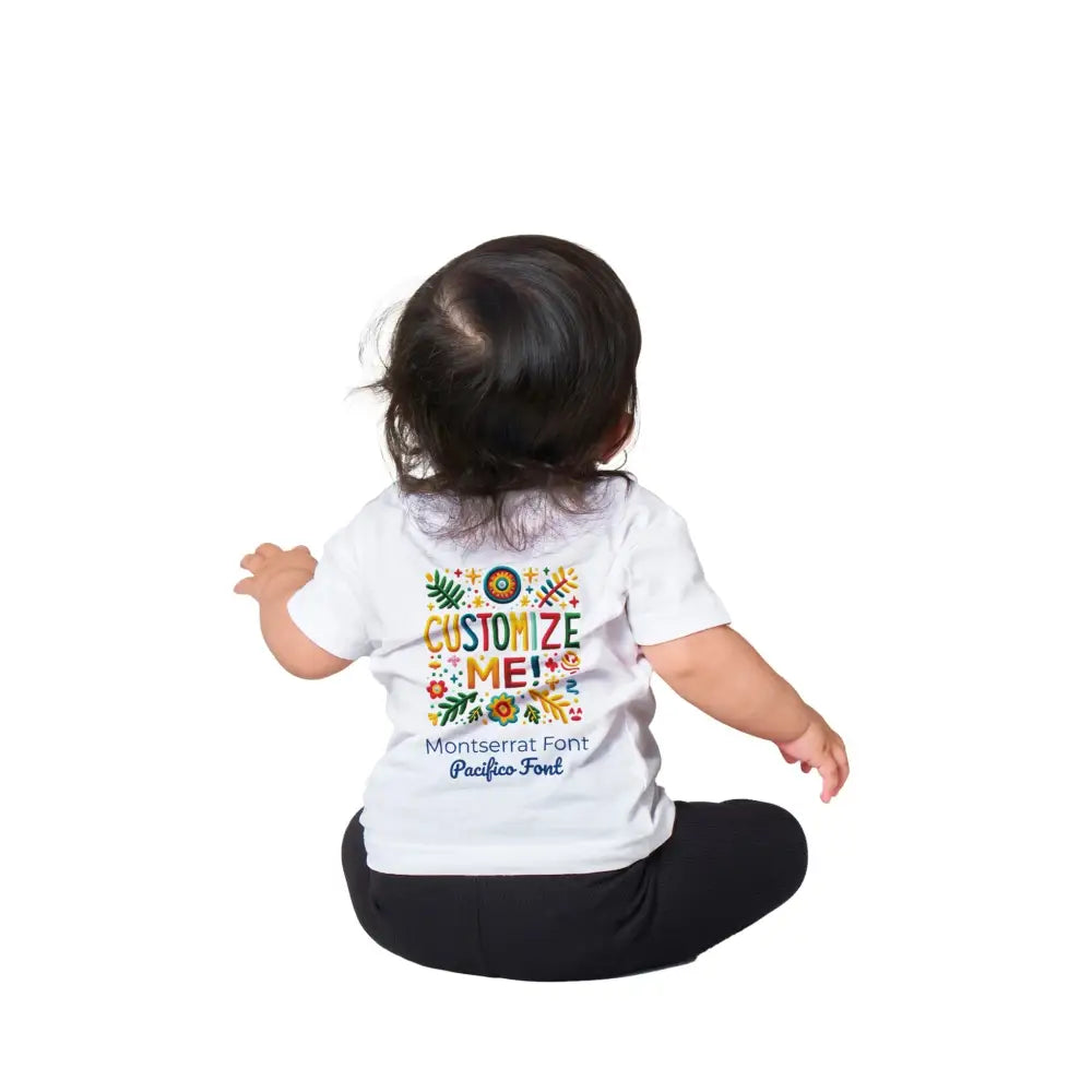 White baby t-shirt with colorful folk-art design on Trini Skies cotton crewneck