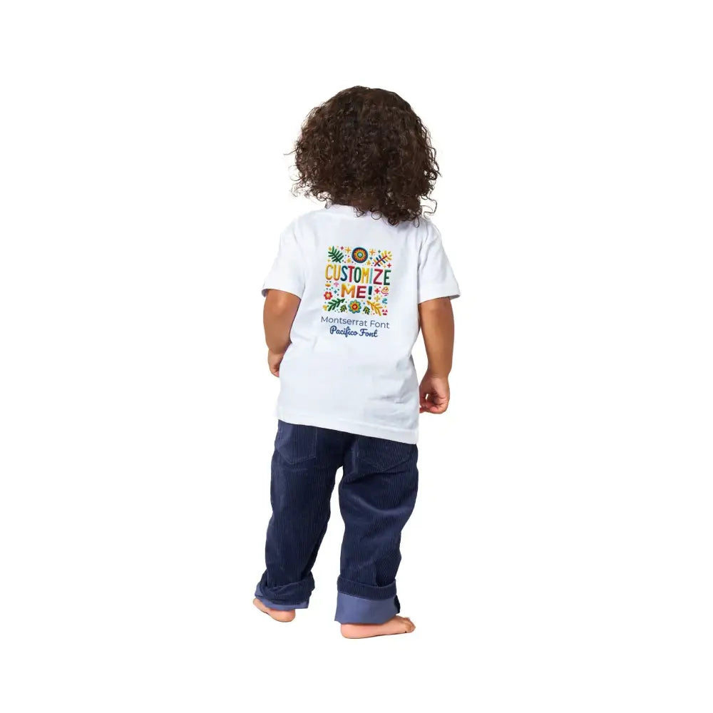 Toddler in white Customize Me Baby Graphic Tee with trini skies embroidery