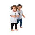 Two toddlers in favorite dinosaur personalized graphic tees