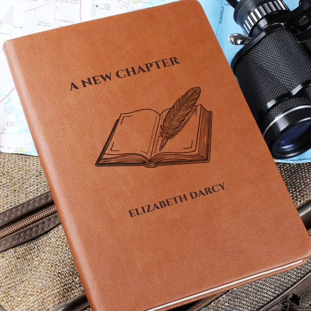 Brown faux-leather chapter journal with embossed book and quill design