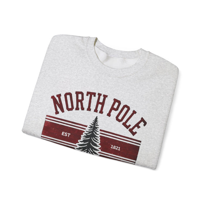 Printify Sweatshirt Ash / S North Pole University Graphic Varsity Merry Christmas Sweatshirt Heavy Blend Crewneck