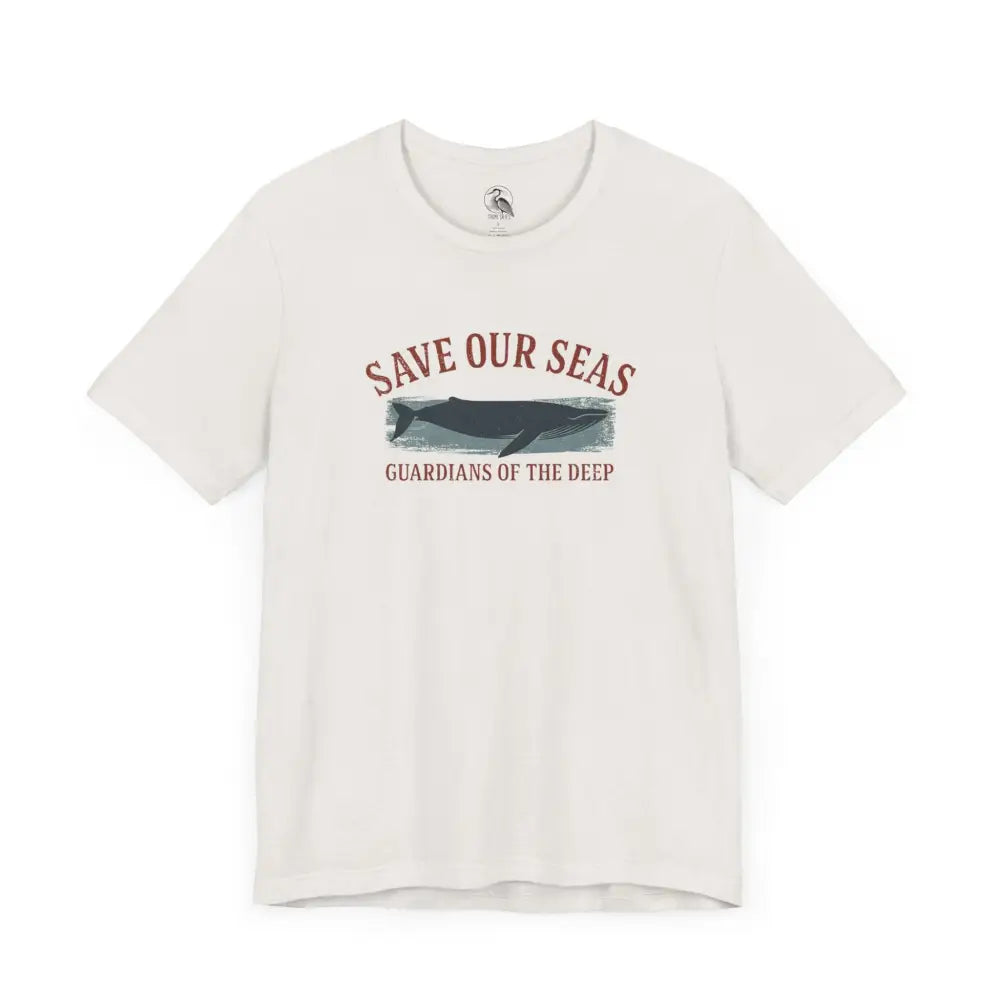 Cream-colored Trini Skies whale graphic tee with classic crew neckline