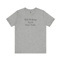 Gray minimalist Bella Canvas NYC tee with Still Waking Up in New York print