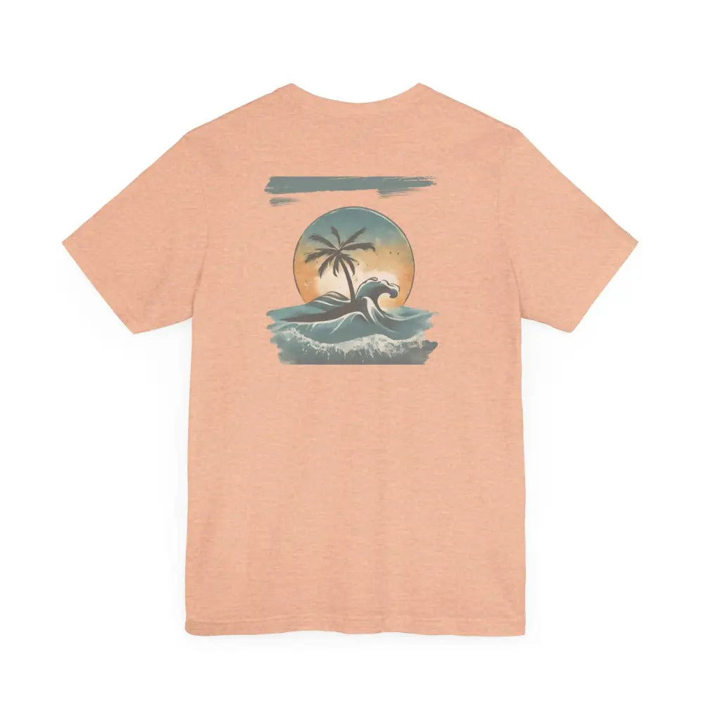 Tropical Oasis Paradise peachy-orange graphic tee with palm tree sunset