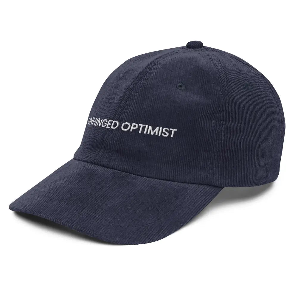Navy blue embroidered corduroy cap with Unhinged Optimist by Trini Skies